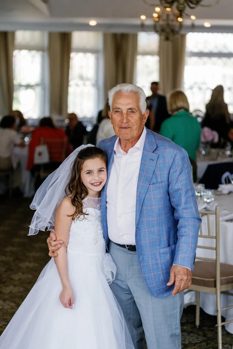 Grandfather with granddaughter at her first communion