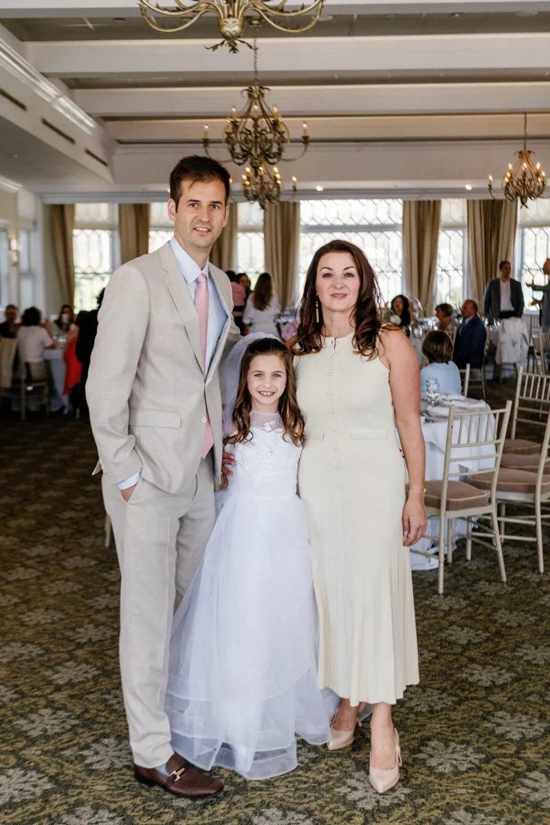 Parents with daughter with her first communion