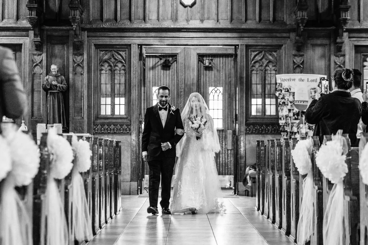 Bride walking down the aisle with father