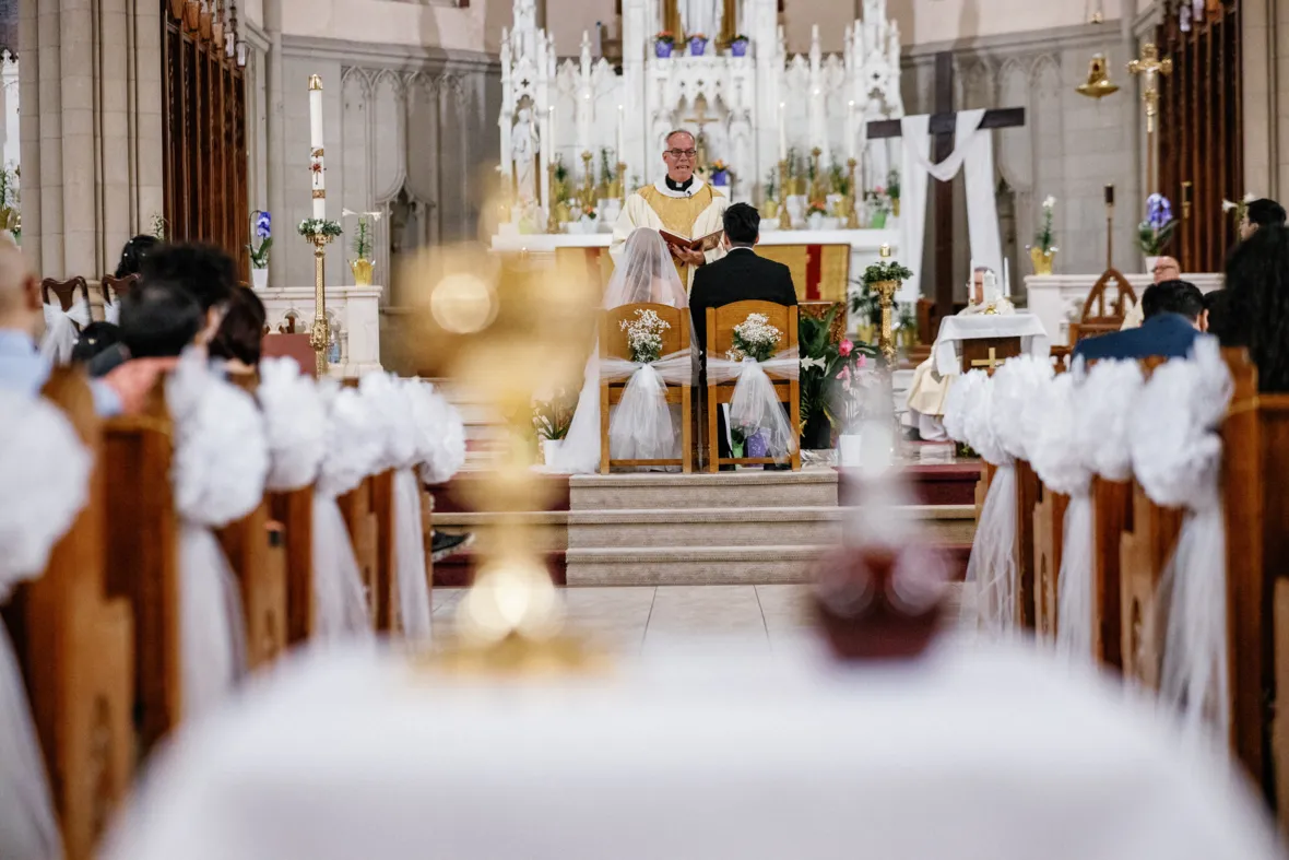 Priest performing wedidng ceremony in church