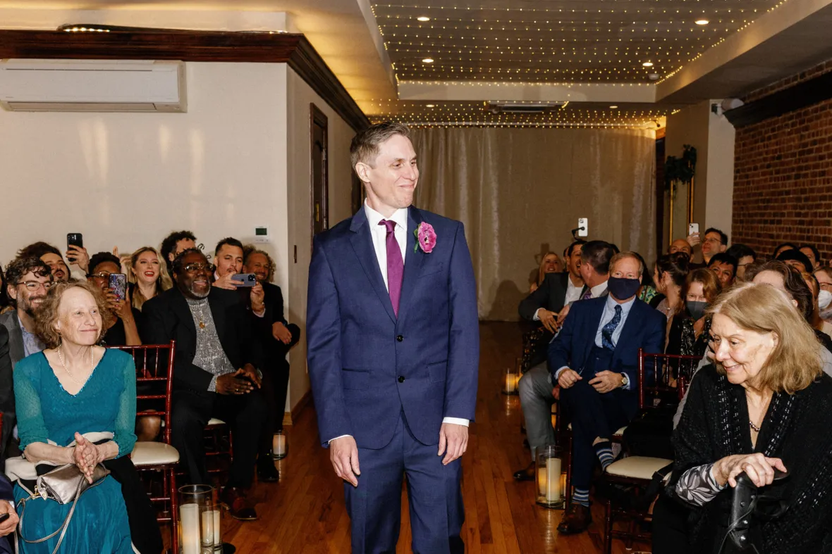 Groom walking down the aisle