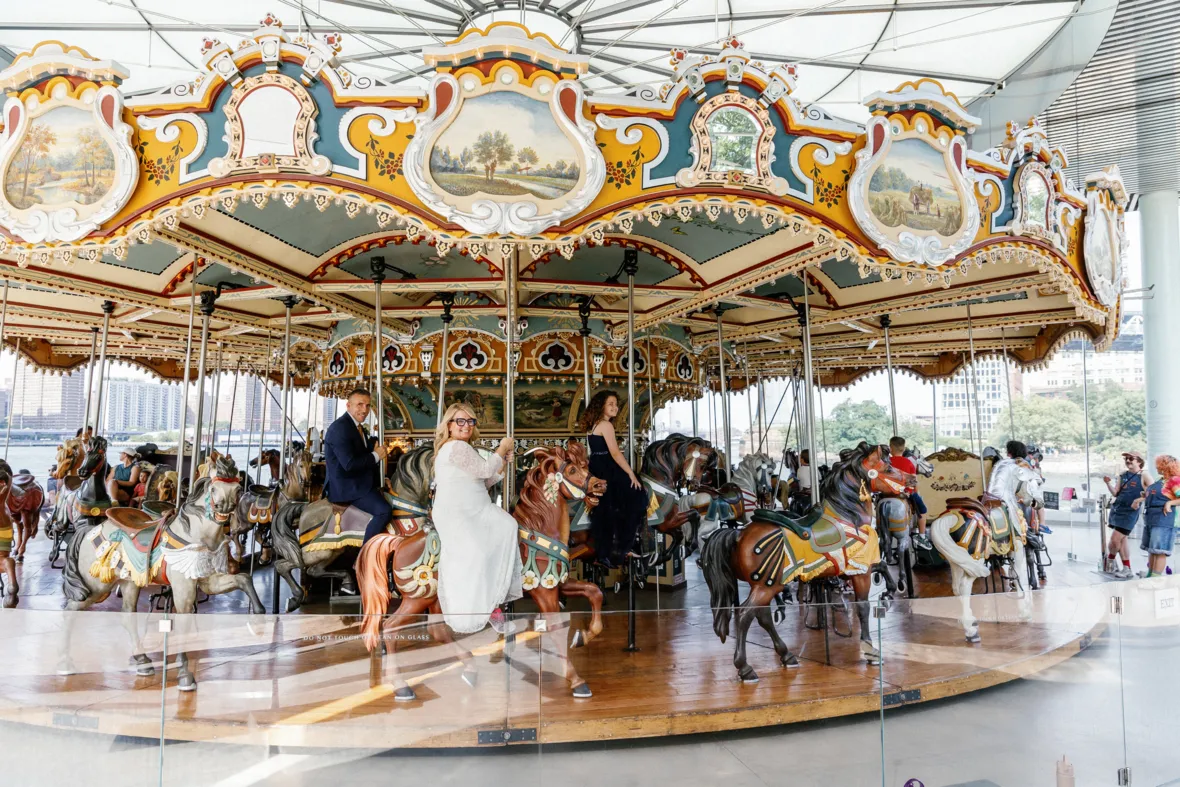 Family on Janes carousel in DUMBO