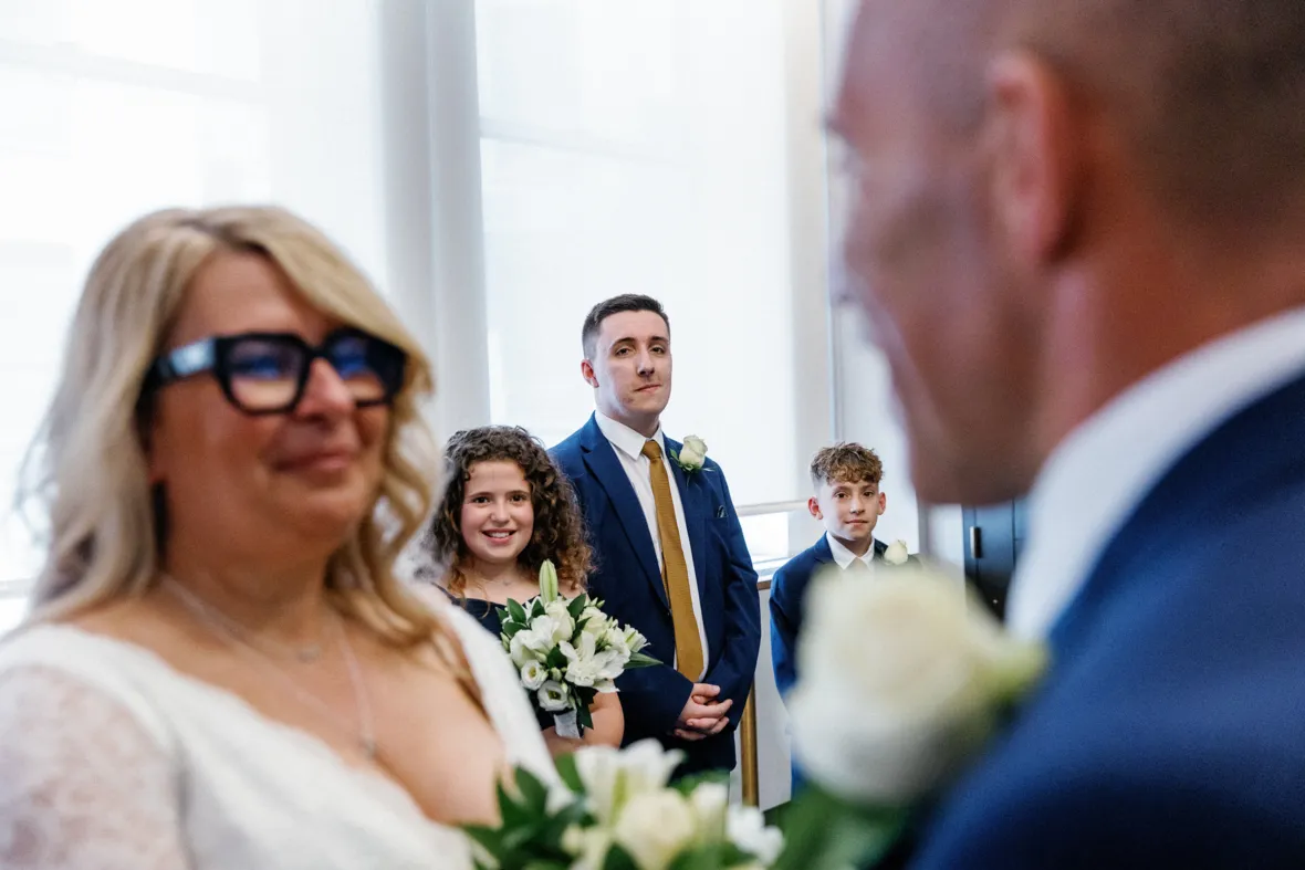 Children of couple watching elopement ceremony