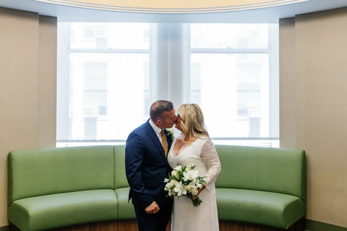 Couple kissing in city hall