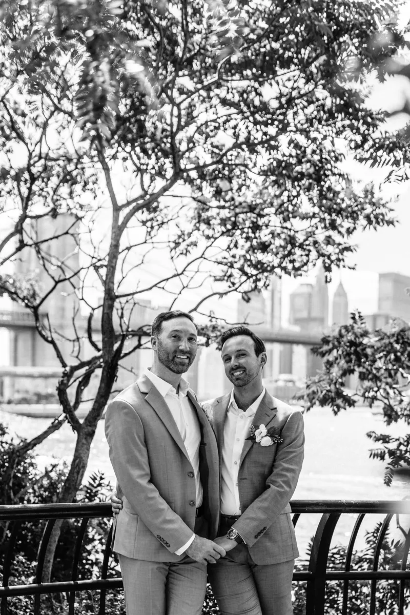 Black and white photo of gay couple in DUMBO