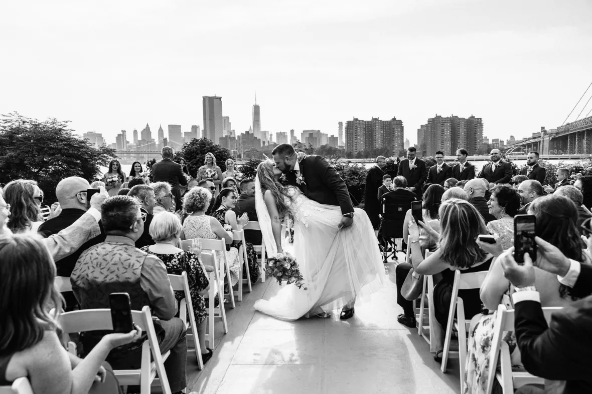 Bride and groom wedding ceremony recessional and kiss