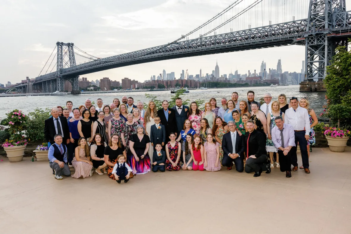 Group wedding photo under the Williamsburg Bridge