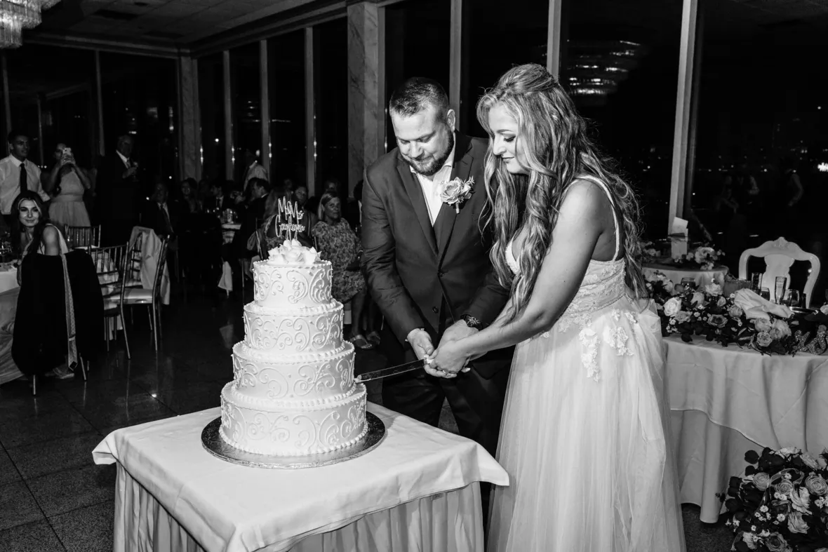 Bride and groom cutting the cake