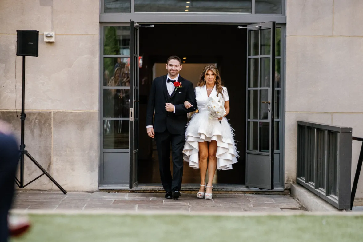 Bride walking down the aisle with son