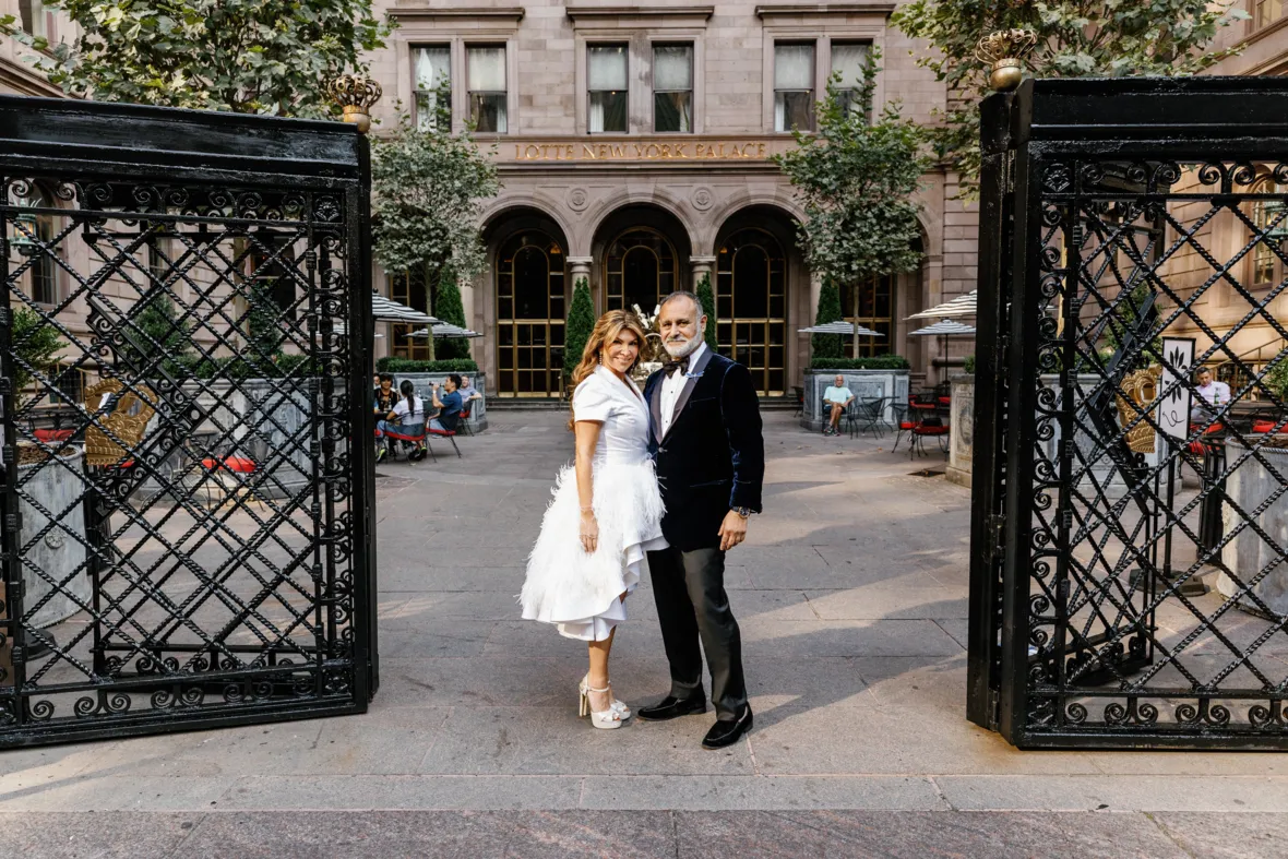 Bride and groom in front of Lotte New York Palace hotel