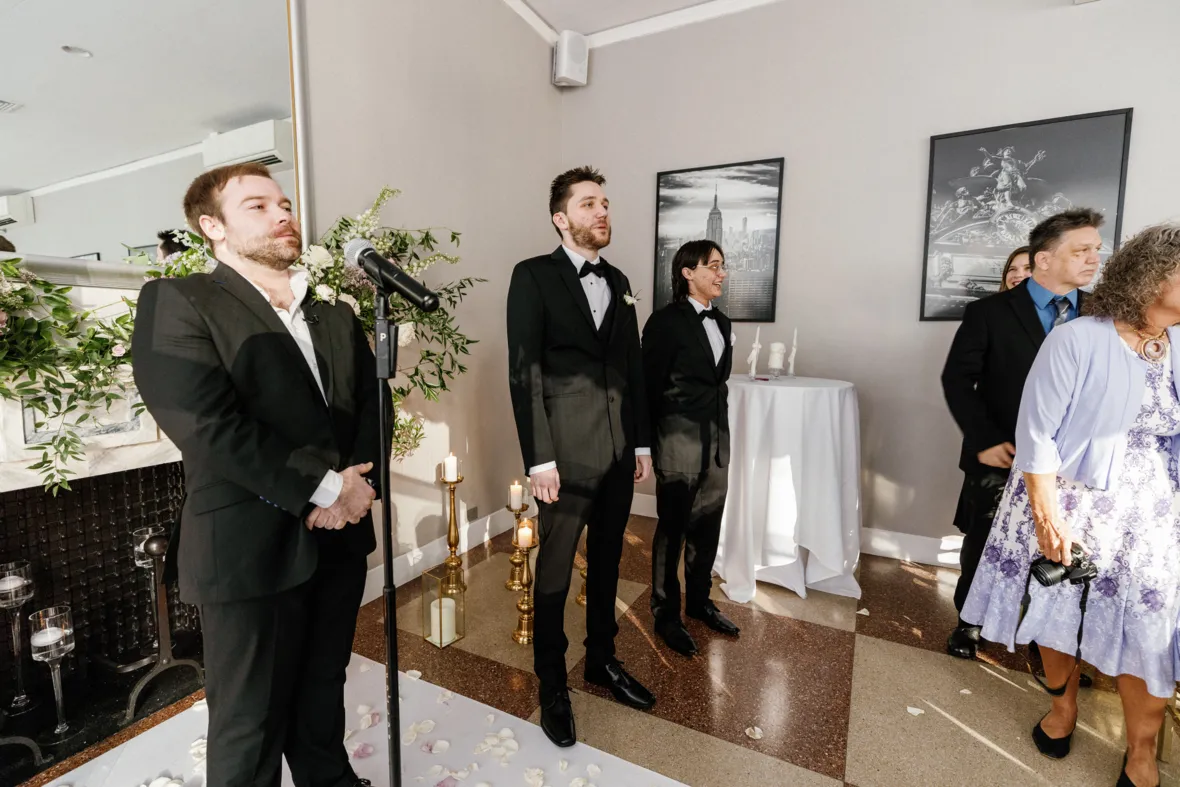 Grooms reaction to seeing bride walk down the aisle