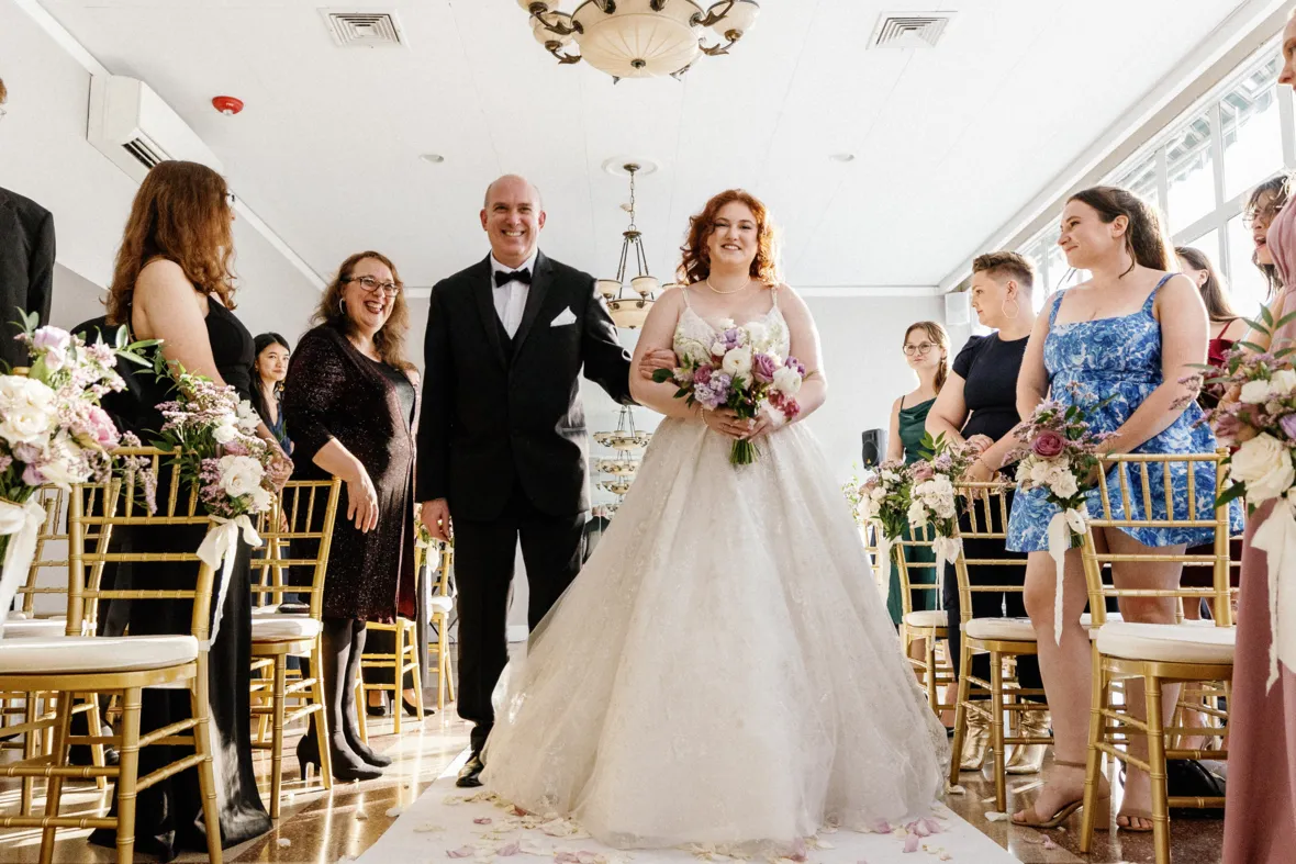 Bride walking down the aisle with father